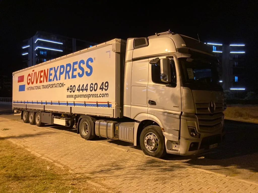 GüvenExpress international freight truck during a night operation