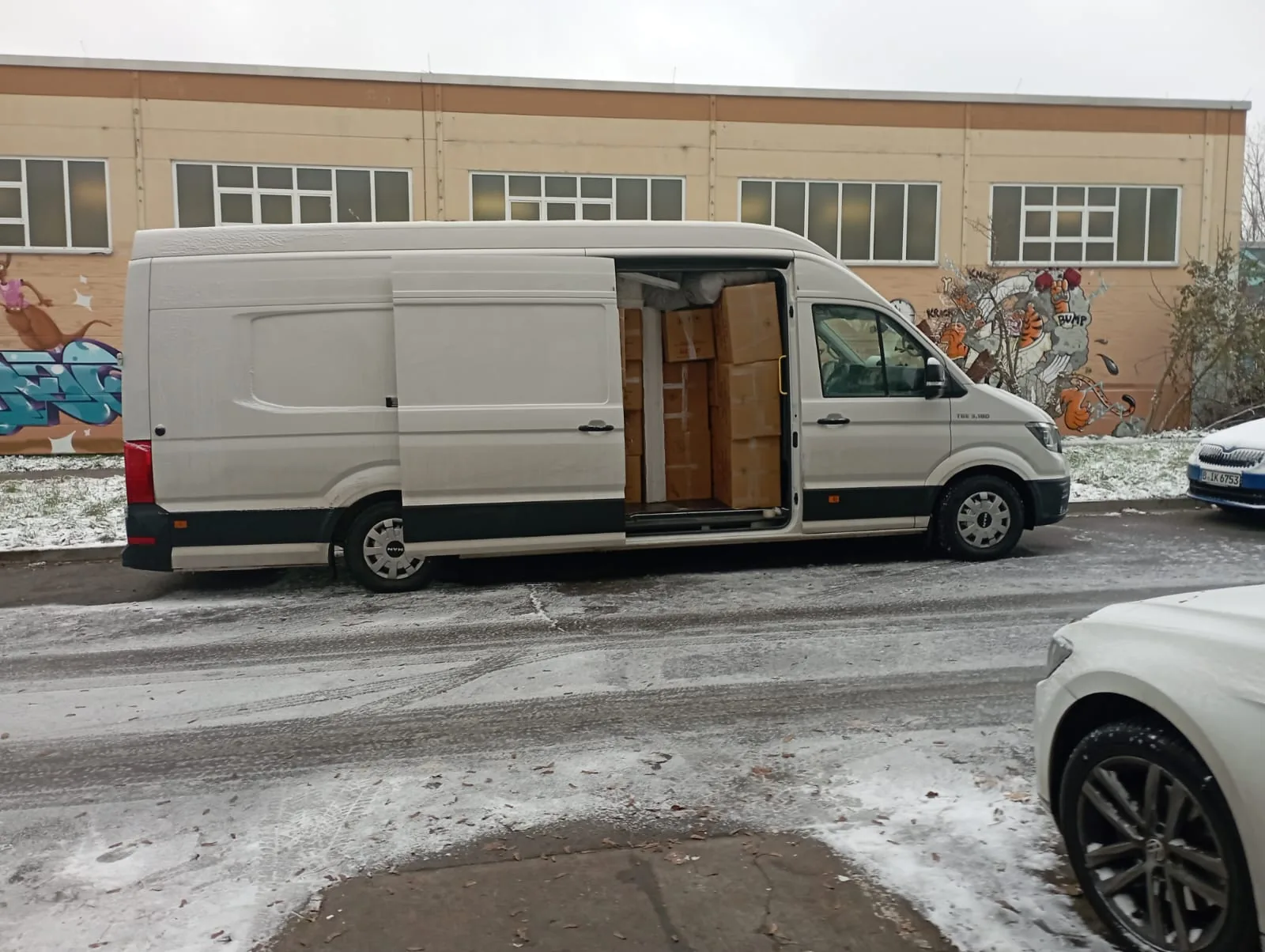 Delivery van loaded with boxed goods for urban distribution