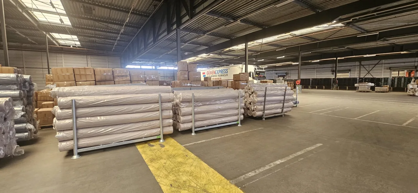 Packaged rolls and commercial cargo stored inside a GüvenExpress warehouse operation